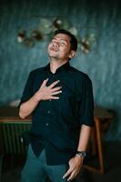 Man experiencing strong emotion with hand on chest in a moment of honesty photo