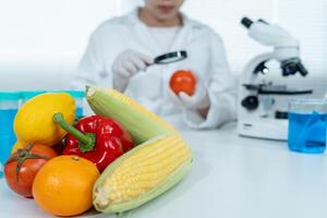 Scientist check chemical food residues in laboratory. Control experts inspect quality of fruits, vegetables. lab, hazards, ROHs, find prohibited substances, contaminate, Microscope photo