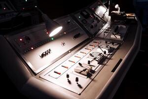 A control panel with lights and buttons on it photo