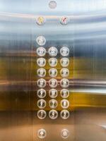 An elevator with buttons and numbers on it photo