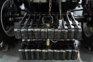 A close up of a tractor with a chain attached to it photo