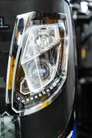 A close up of a car headlight photo