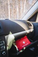 A comprehensive first aid kit is conveniently located in the glove box of your car, ensuring it is readily accessible to be used in case of any emergencies that may arise while driving photo