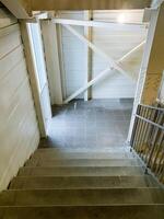 When observing from above a staircase within a particular building, one can appreciate the intricate design and craftsmanship involved in the construction of the stairs themselves photo