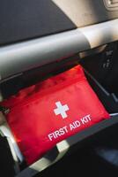 A wellstocked and organized first aid kit is conveniently stored in the cars trunk, allowing for easy access during any emergencies that may unexpectedly arise while traveling on the road photo