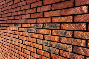 This image features a detailed closeup of a stunning red brick wall that is beautifully outlined with a striking black border, showcasing the intricate textures and patterns of the bricks photo