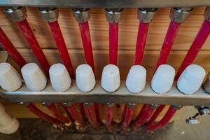 This extensive and diverse collection showcases an array of red pipes adorned with striking white caps, making them ideal for a wide range of construction and industrial applications photo