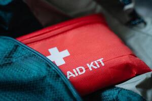 The Essential Red First Aid Kit is specifically designed for Emergency Preparedness, perfect for both Outdoor Adventures and enhancing Indoor Safety during unforeseen situations photo