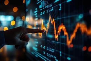 A business person interacting with charts and diagrams on a stock market screen... photo