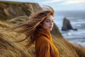 a woman Adventurer in Golden Coastal Wilderness, resilient grasses that cling to rugged cliffs showcase their remarkable adaptability, their tenacious grip on erosion control. photo