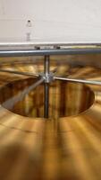 Extracting fresh organic honey in the electric centrifuge appliance. Special machine with centrifuge mechanism rotates the frames with honey. Vertical video