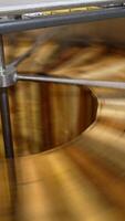 Honey frames are rotated in the centrifuge. Close up. Removal of fresh harvest of honey in the extractor machine. Vertical video