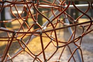 View of an alpine trellis on a playground in a public park on a sunny day photo
