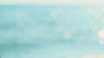 Blurred Ocean Water with Light Bokeh video