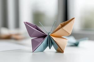 An exquisite origami butterfly made from colorful paper sits gracefully on a bright tabletop. Light filters through the window, highlighting the delicate folds and craftsmanship of this art piece photo
