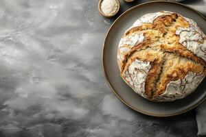 Round loaf of soda bread sits on a dark plate, celebrating irish american heritage with its simple, wholesome goodness photo