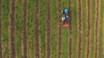 Tractor vehicles working at field Top View video