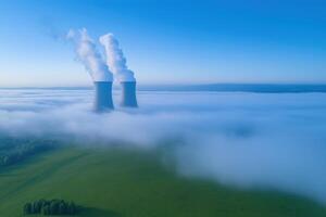 Cooling towers of nuclear power plant in the clouds, aerial view photo