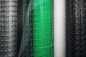 Rolls of plastic and steel wire mesh in various sizes and patterns photo