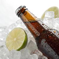 A close-up of a cold bottle of soda with ice cubes and lime on the side., isolated on a white background photo