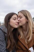 Two young women, They are leaning in close, about to touch noses, with soft expressions photo