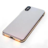 A back sleek smartphone with a soft glow on its edges, isolated on a white background photo