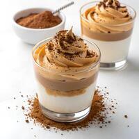 Dalgona Coffee dessert parfait, layered with cream and coffee foam. isolated on a white background photo