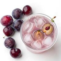 Top view of Iced Plum Tea with whole plums floating, isolated on white background photo