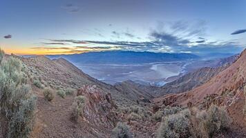 Breathtaking panoramic view of Death Valley from a high mountain vantage point p photo