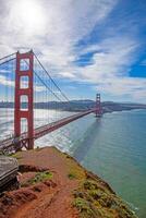 Golden Gate Bridge with blue sky and scenic ocean view from a high vantage point d photo