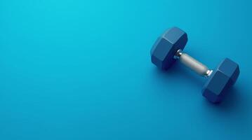 Blue dumbbell with metal handle placed on blue background, fitness equipment concept for gym, strength training, and exercise design with copy space photo