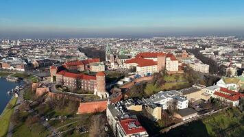 Aerial view of Wawel Castle complex in Krakow, Poland, surrounded by historic buildings and Vistula River. video