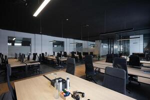 Modern business, glass-walled startup office, open and spacious workspace exudes a modern and innovative vibe, fostering a dynamic atmosphere that supports creativity, collaboration, and business photo