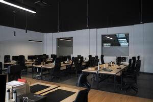 Modern business, glass-walled startup office, open and spacious workspace exudes a modern and innovative vibe, fostering a dynamic atmosphere that supports creativity, collaboration, and business photo