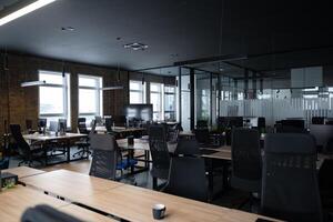 Modern business, glass-walled startup office, open and spacious workspace exudes a modern and innovative vibe, fostering a dynamic atmosphere that supports creativity, collaboration, and business photo