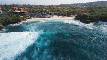 Tropical beach with ocean in Lembongan island. Aerial view of beach with ocean waves video