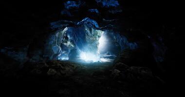 Mysterious cave illuminated by beams of light reflecting through rocks video