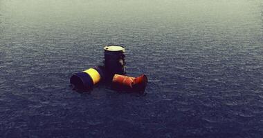 Three barrels float in calm water during a gray overcast day video