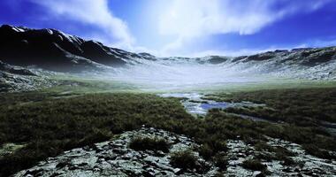 Vast mountain landscape with mist and shadows under a bright sky video
