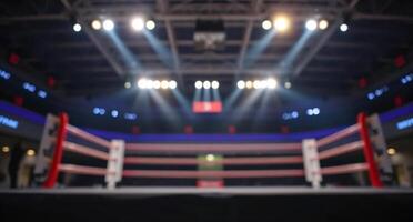 Boxing ring with lights in the middle of the arena photo