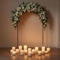 Funeral wreath with an empty center for text or photo, hanging on a plain wall with white candles burning below, creating a solemn atmosphere.1 photo