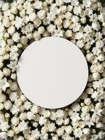 Top down view of an empty podium surrounded by white funeral flowers in a serene setting.2 photo