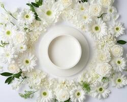 Top down view of an empty podium surrounded by white funeral flowers in a serene setting.nz photo