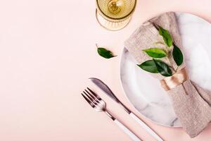 Wedding or festive table setting in natural style. Minimalistic arrangement photo