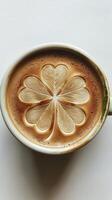 Top view of a cup of Irish coffee with leaf clover on a white background, St. Patricks Day photo