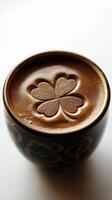 Cup of creamy hot chocolate with a four-leaf clover design in the froth, warm and inviting beverage photo