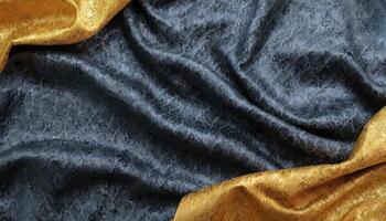 A black and gold silk fabric with a gold border photo