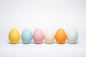 Set of Pastel Colored Easter Eggs Arranged on a White Background for Spring and Holiday Decoration photo