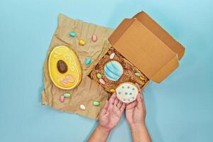 Easter baking sweets gleam on pastel backdrop, easter charm radiating extra joyful mood, easter theme blending vibrant icing and delicate shapes, enchanting families with seasonal fun photo