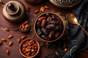 Dates and nuts on a wooden table photo